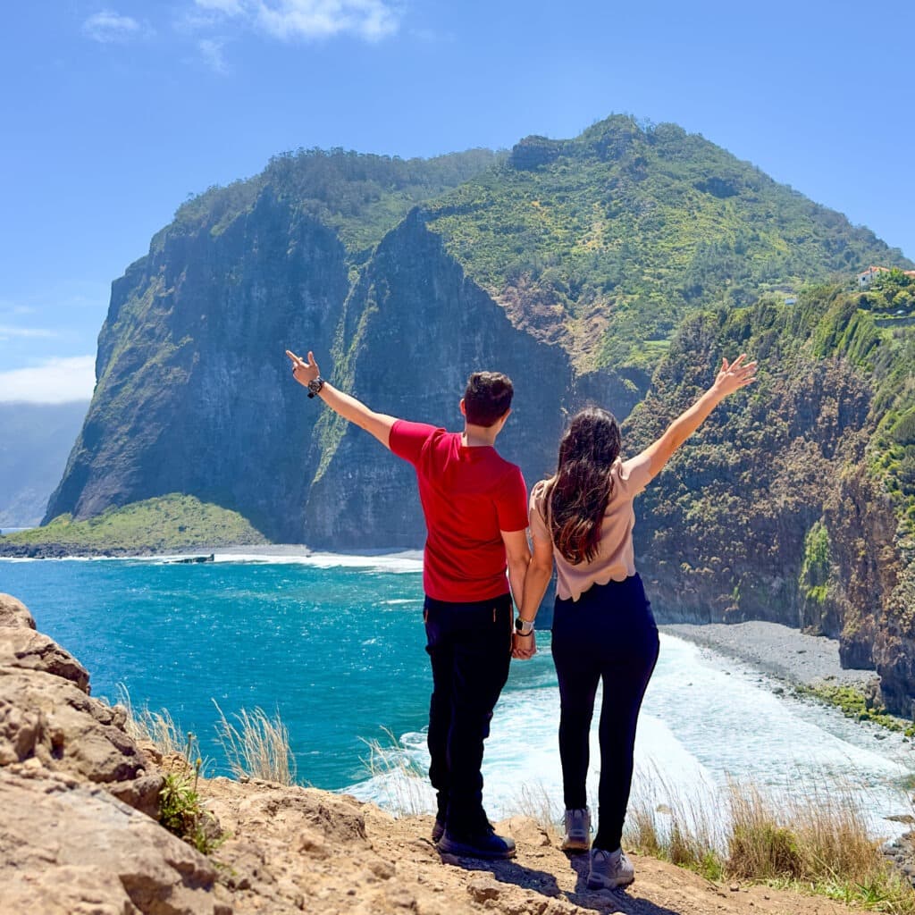 A couple looking at a mountain and beach on Madeira, Portugal